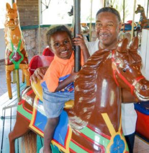 Father and son at the carousel